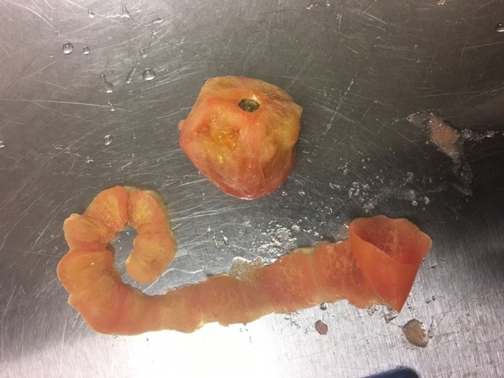Peel and separate skin from the tomato. DIscard the tomato.