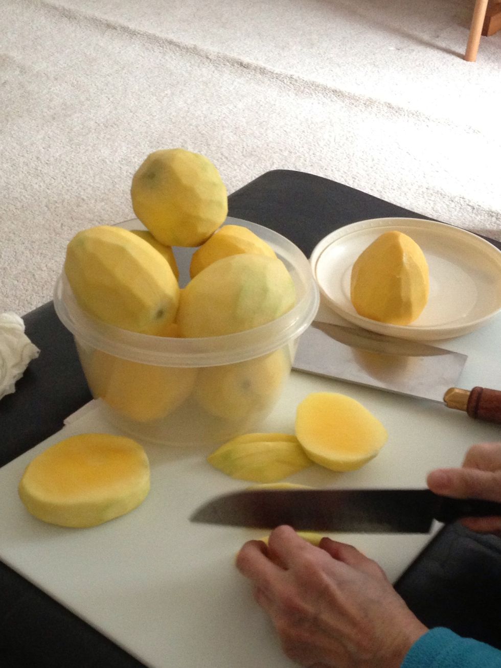 Peel and slice mangoes.
