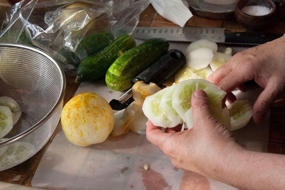 Peel and slice the cucumbers into thin rounds.