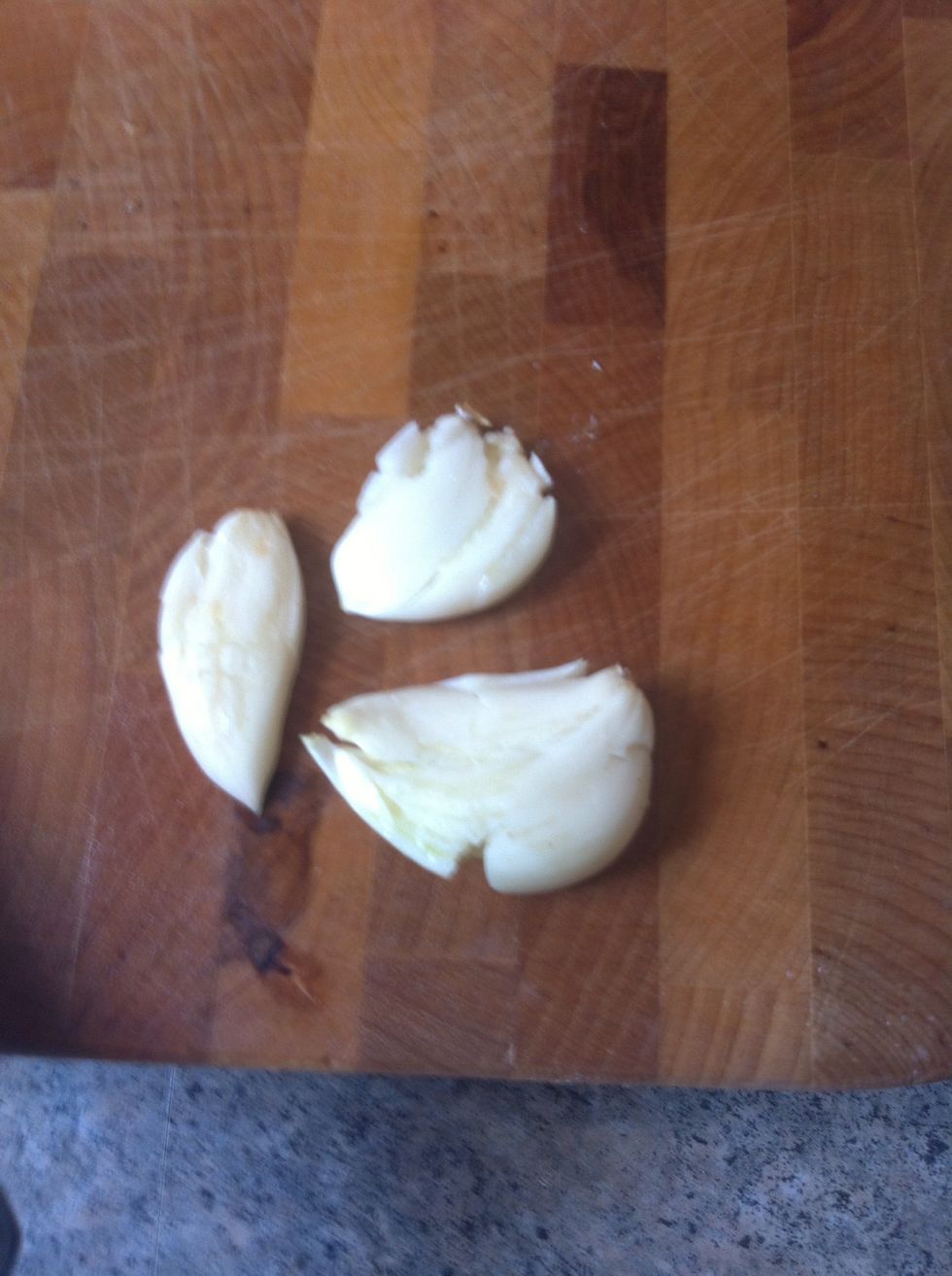 Peel and smash 3 cloves of garlic