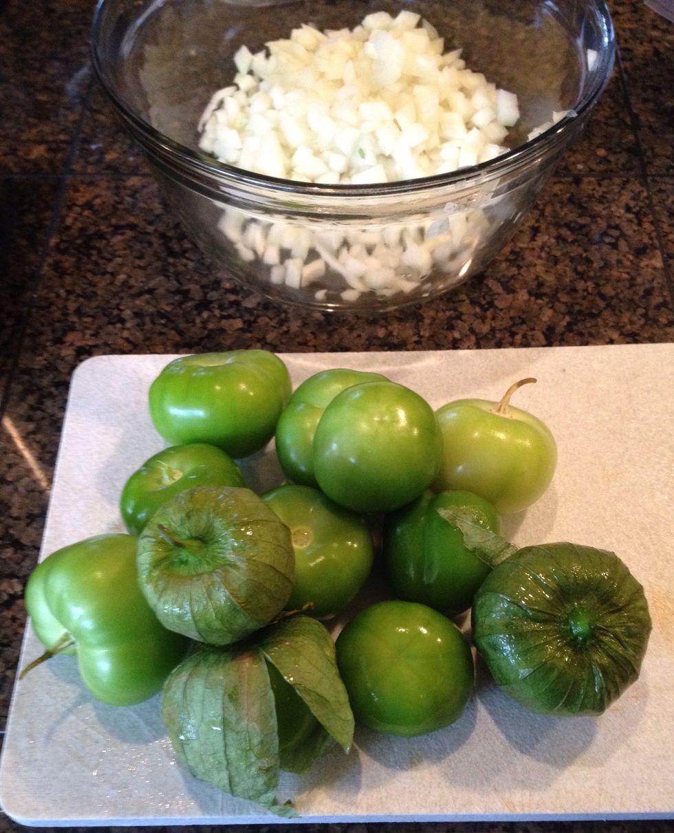 Peel and wash the tomatillos. They have a sticky skin, under their papery coverings.