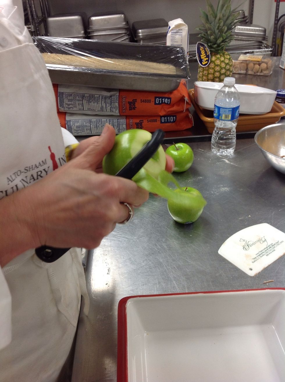 Peel apple skin half way down from the top.