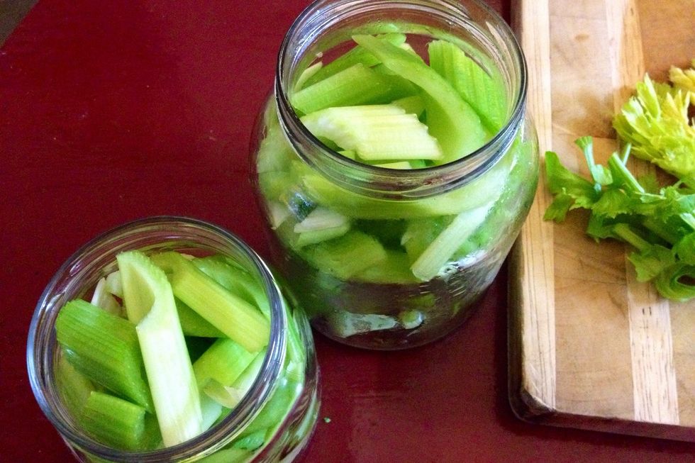 Peel away each stalk of celery from bunch. Wash; cut into nice inch-long diagonal shape and place in sterilized jar. Keep leaves and shoots aside for salad, etc.