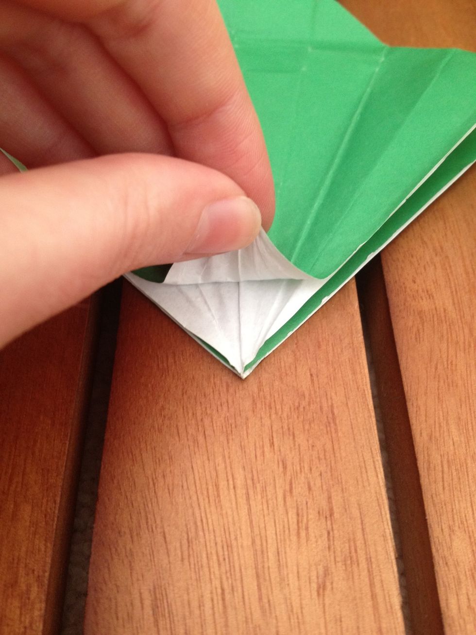 Peel back the very top layer from the bottom right corner.