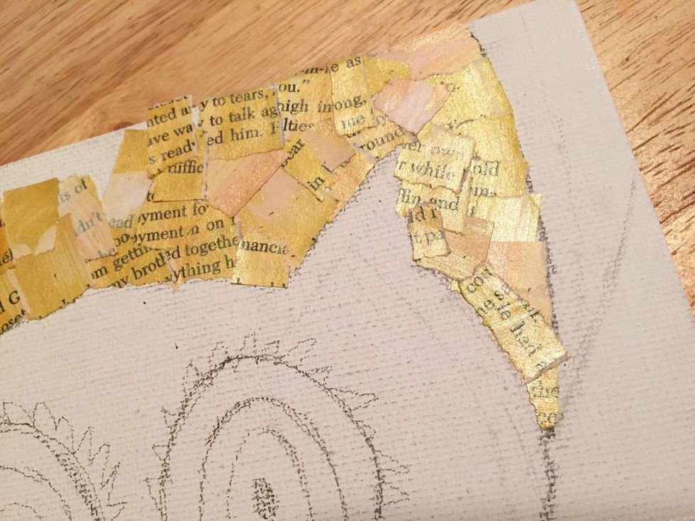 peel backing off pieces - bending a corner makes it easier to remove - and begin to fill in "moon". don't worry if small bits go over lines, you'll be adding more collage bits on top and can define.