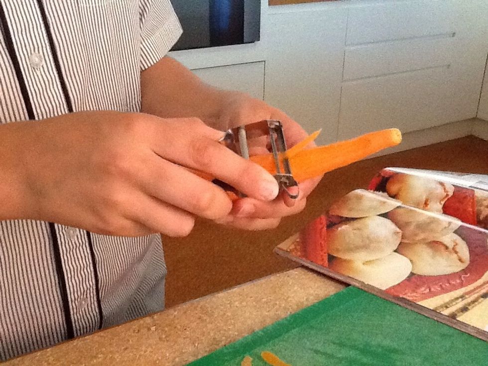 Peel carrots.
