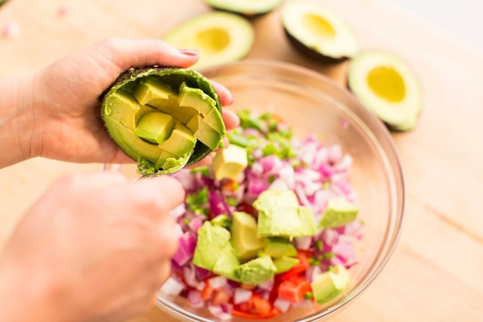 Peel, core and dice avocados. Then, add to bowl. Set bowl aside.