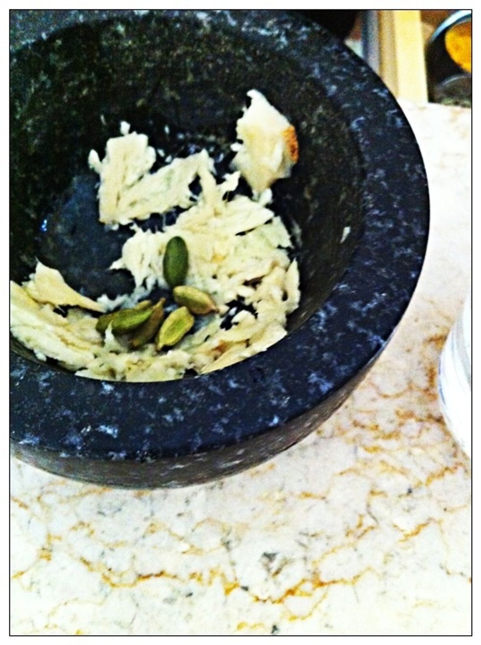 Peel, cut, and mash fresh ginger. Add cardamom pods & black pepercorns.