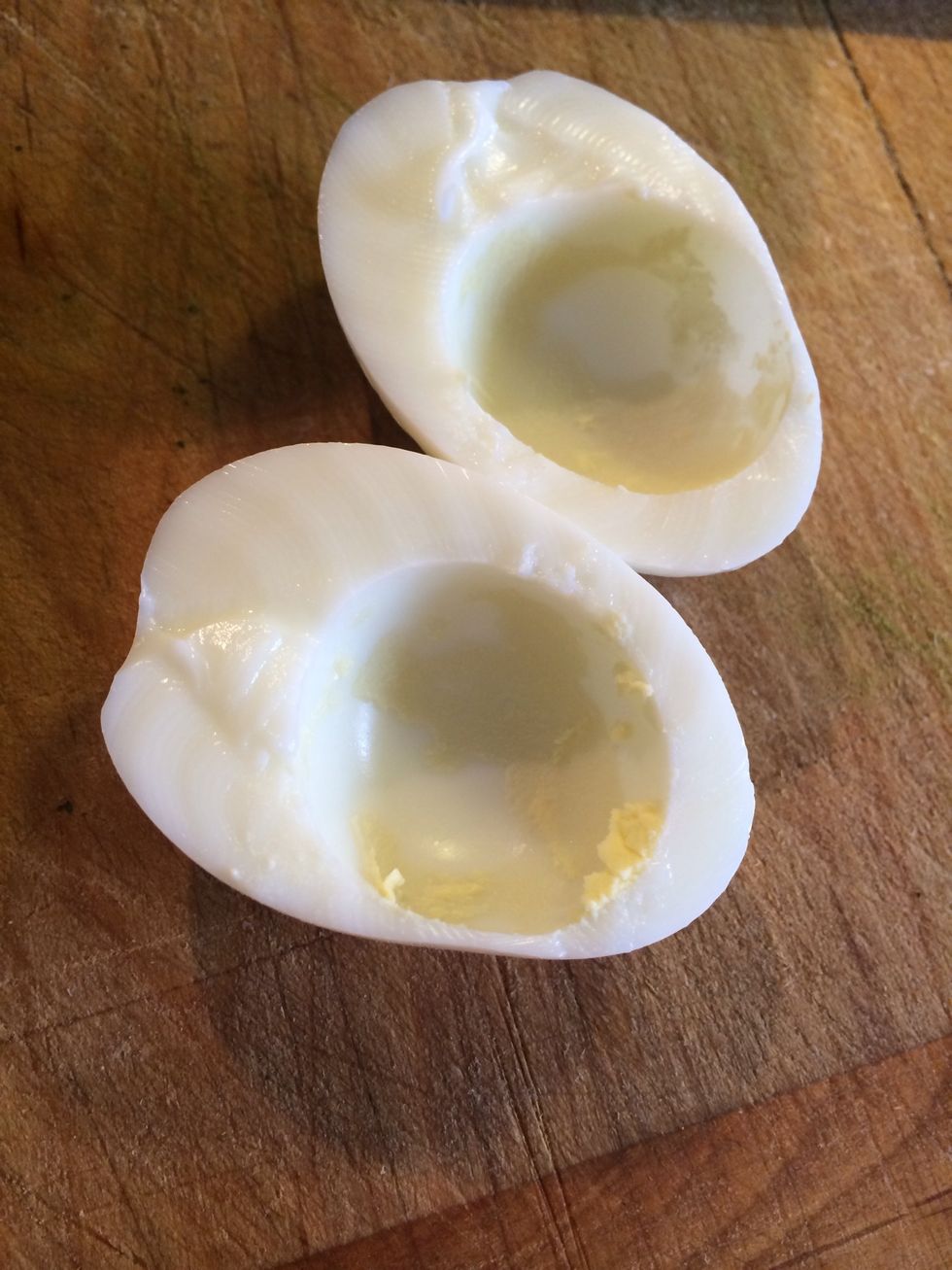 Peel eggs, cut in half and discard the yolk.