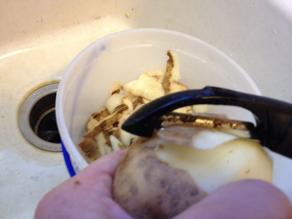 Peel enough potatoes to feed the amount of people you're serving. Figure one good sized tater for each person.