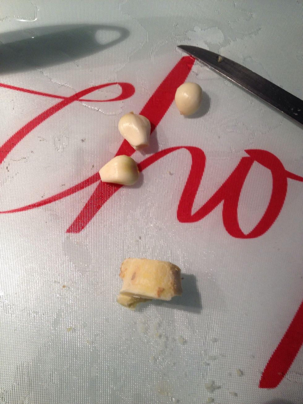 Peel garlic and ginger. top tip: buy ginger, peel then freeze. easier to grate, lasts longer.