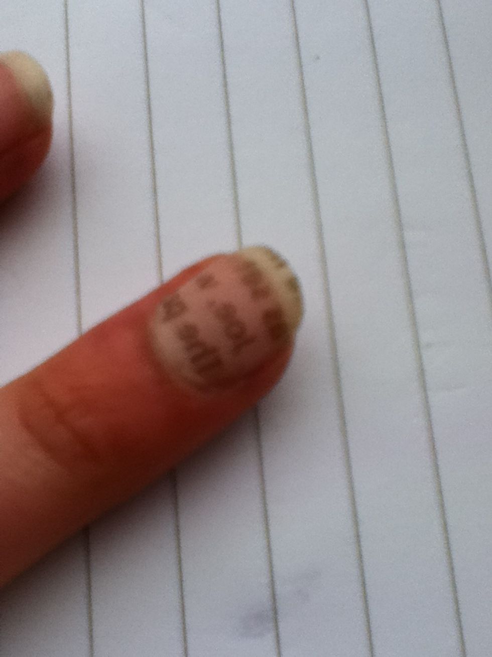 Peel it off and you should be left with the writing.