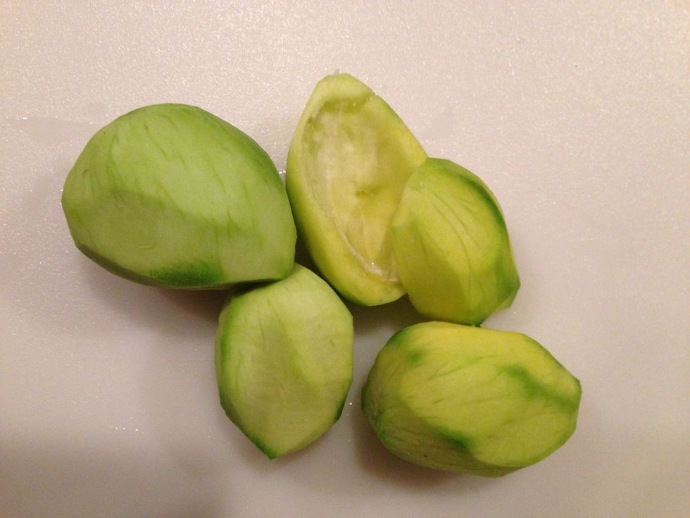 Peel mangoes and remove the seed inside.