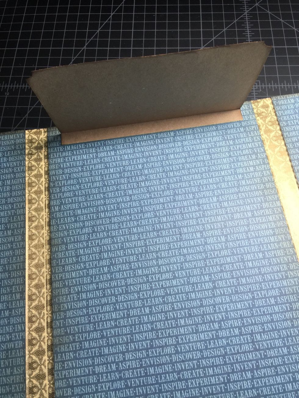 Peel off the backing of the ScorTape and adhere down the smallest flap first (4 1/2x7). Position it as shown in the photo.