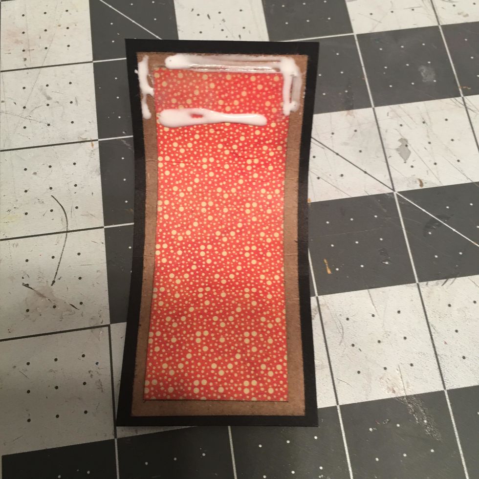 Peel off the tape backing and add glue to the back side.