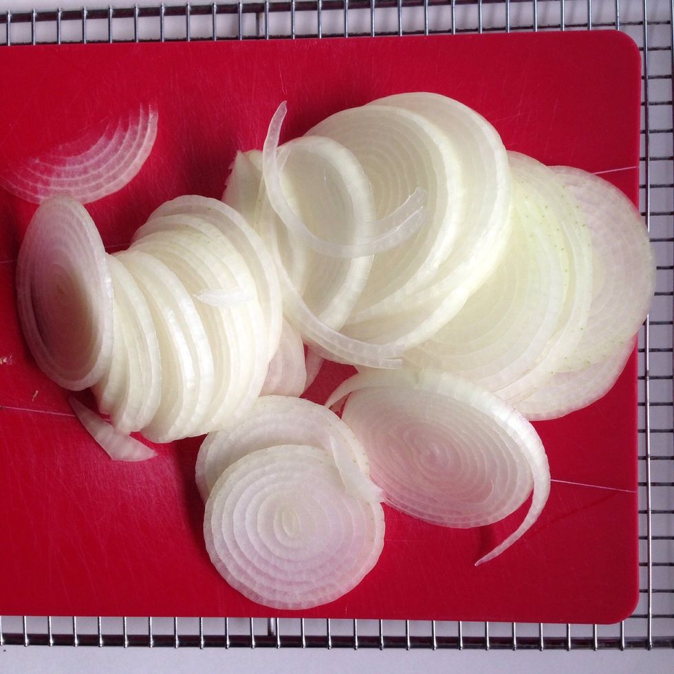 Peel onions and slice into 1/8-inch thick rounds.