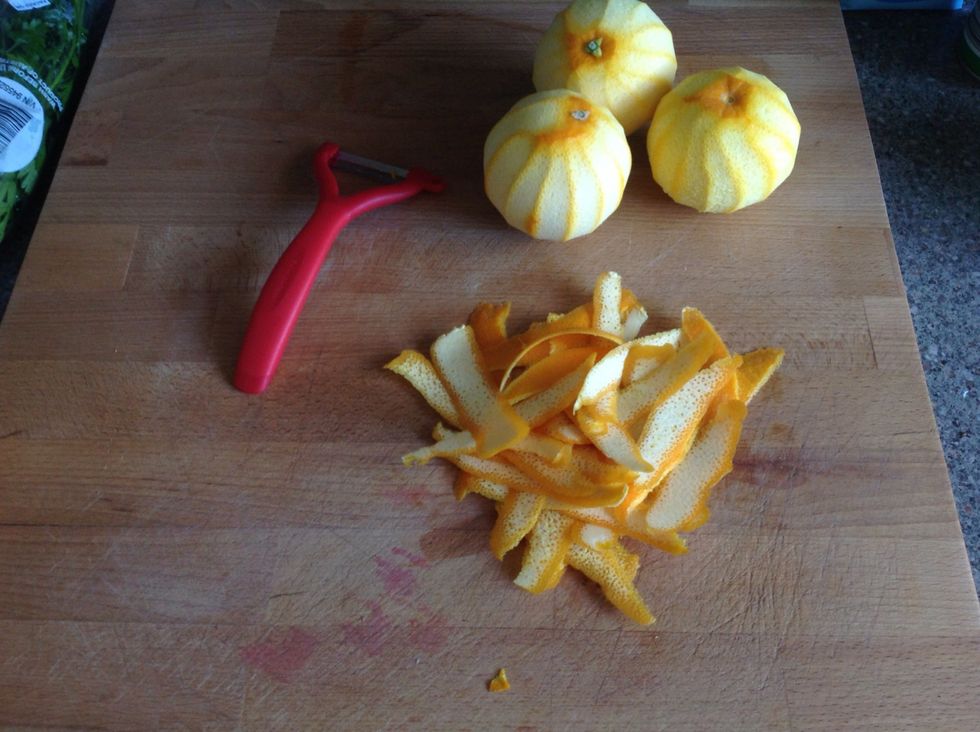 Peel oranges and keep oranges for juice or segments