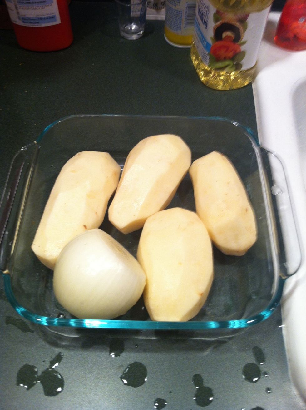 Peel potatoes and onion