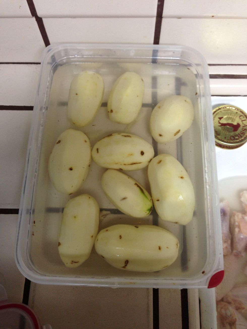 Peel potatoes and place them on water