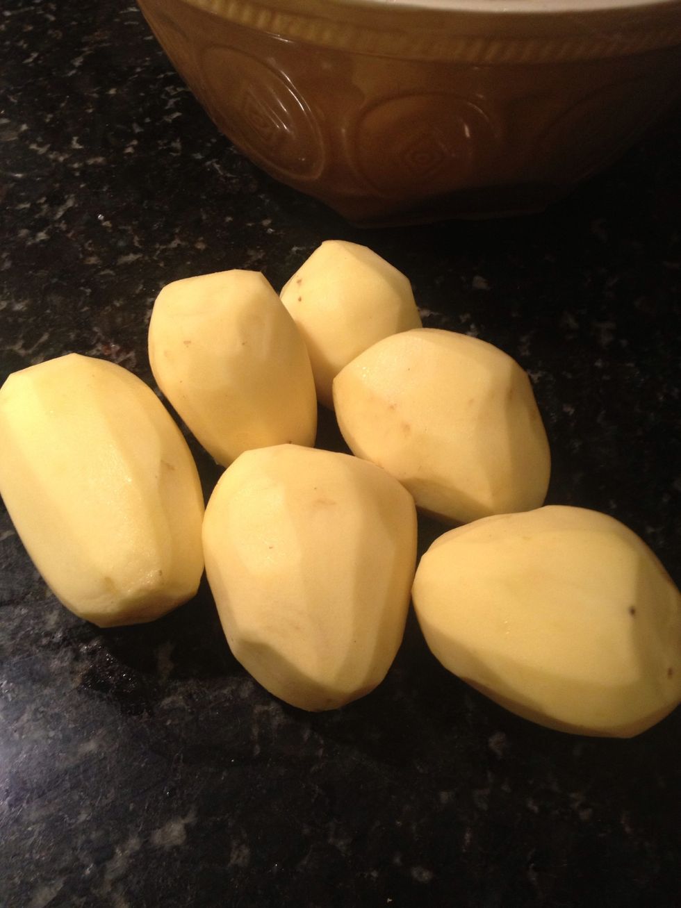 Peel potatoes.
