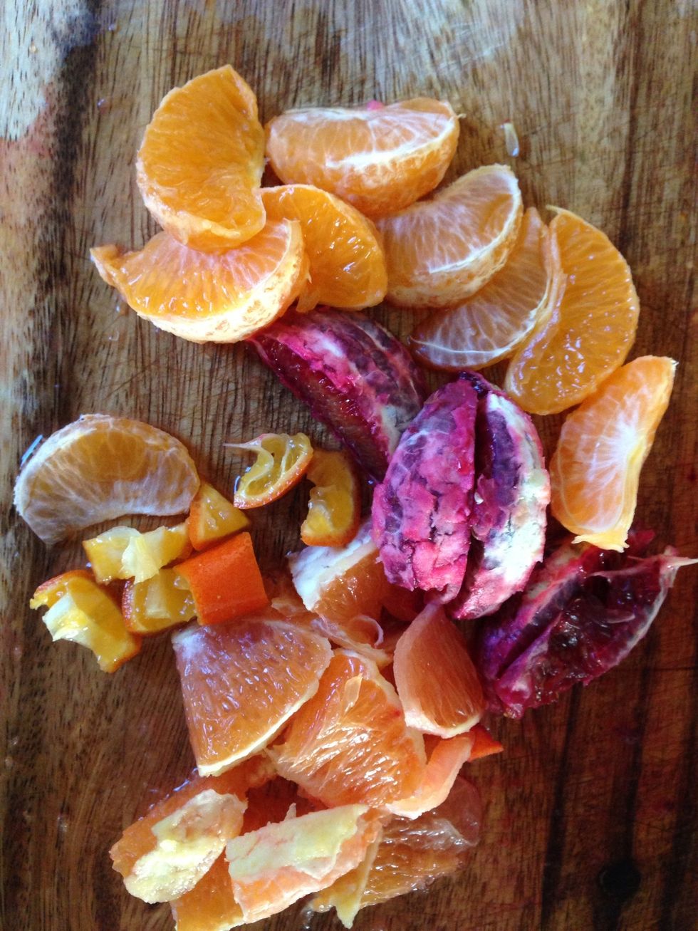 Peel, seed and segment the oranges. Cut larger pieces into bite-sized pieces. The blood oranges and mandarins are usually small enough.