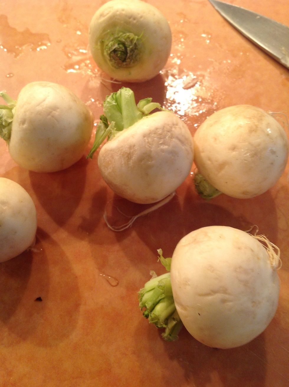 Peel some baby turnips and halve.  Peel some baby potatoes too.