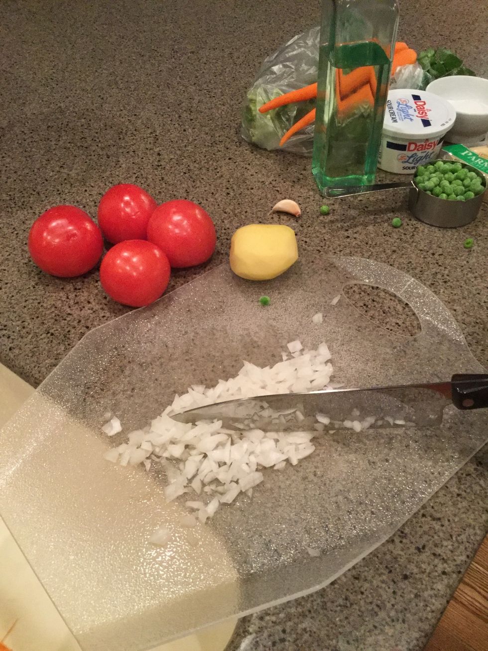Peel some vegetables and then cut them.