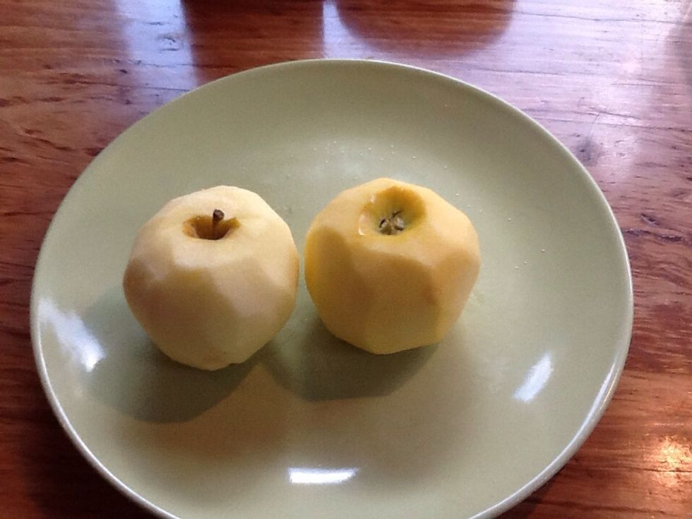 Peel the apples then halve and core them.