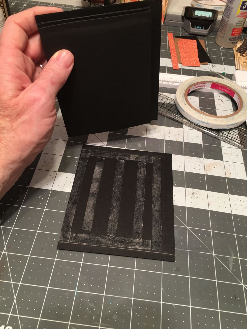 Peel the backing off. Carefully line up the album to the back cover. You want the cover flush to the back edge of the pages and lined up straight on all sides along the pencil lines.