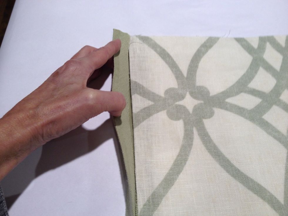 Peel the backing off the steam-a-seam. Starting at the top left corner of the shade. Place the banding under the raw edge of the shade.