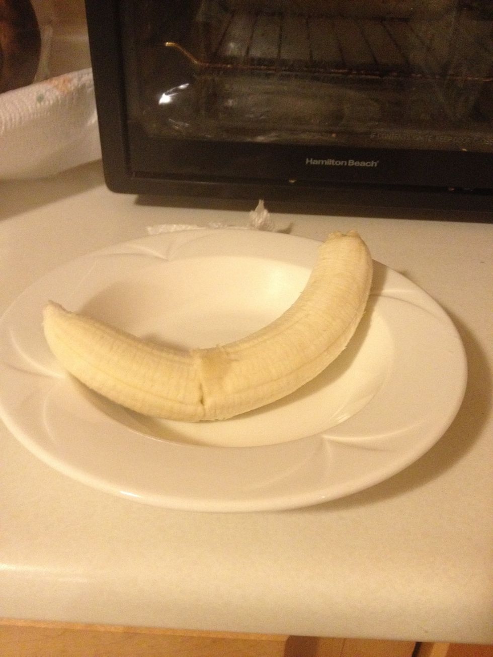 Peel the banana and put it on the plate you can cut it long wise and put it like that