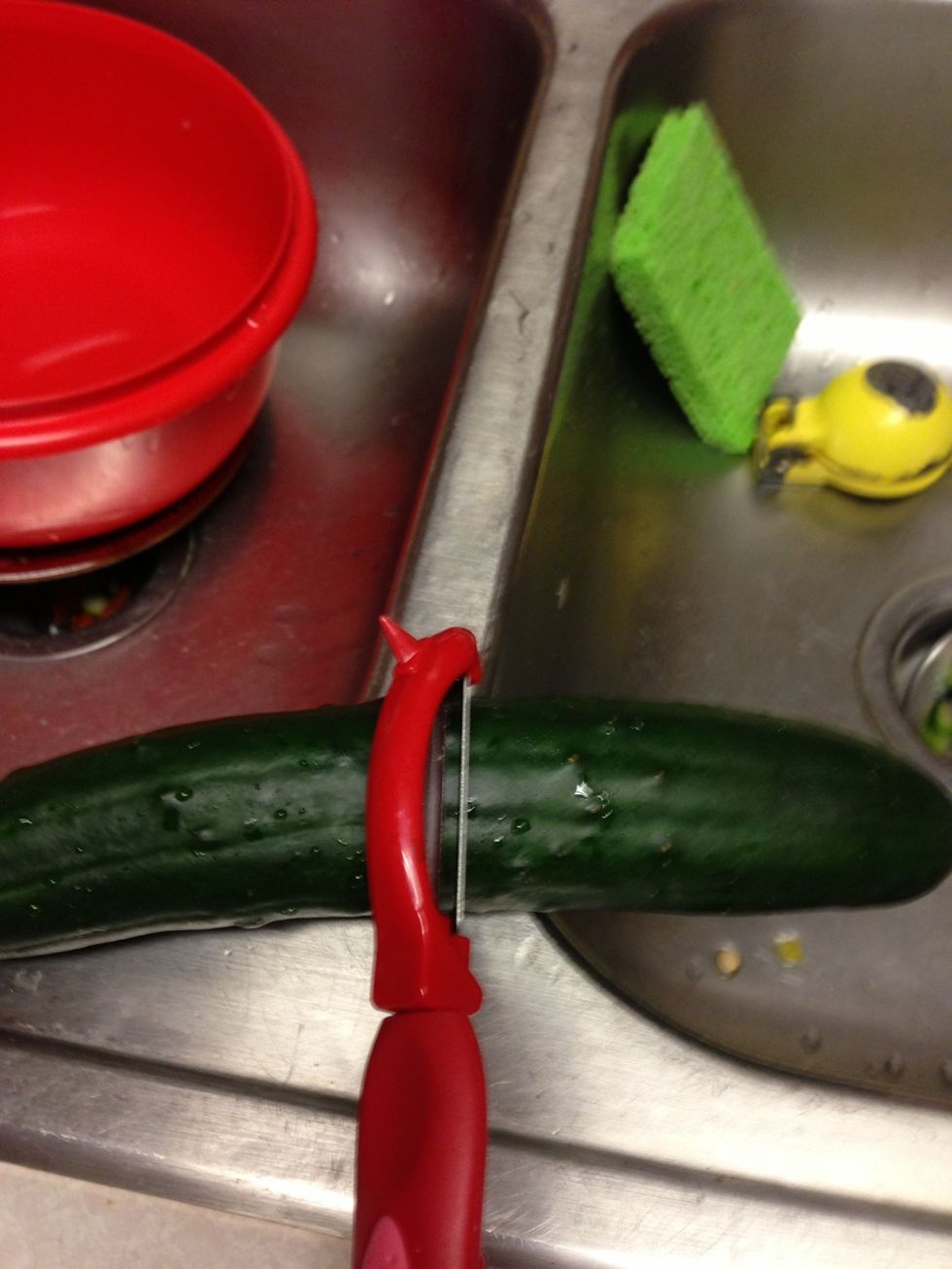 Peel the cucumbers and cut them in small pieces.