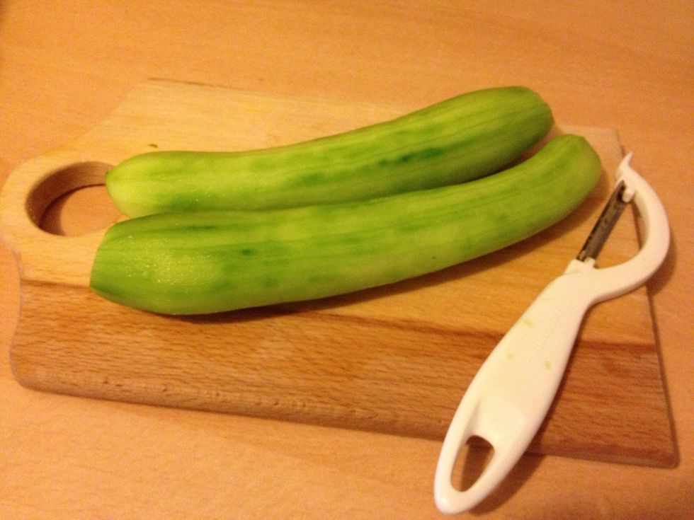 Peel the cucumbers.