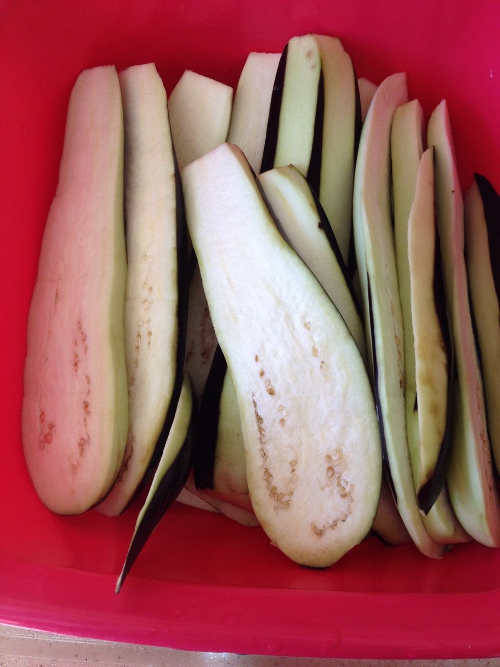 Peel the eggplants and cut them in medium size. You can keep them wait in salty water so they wint get dark.
