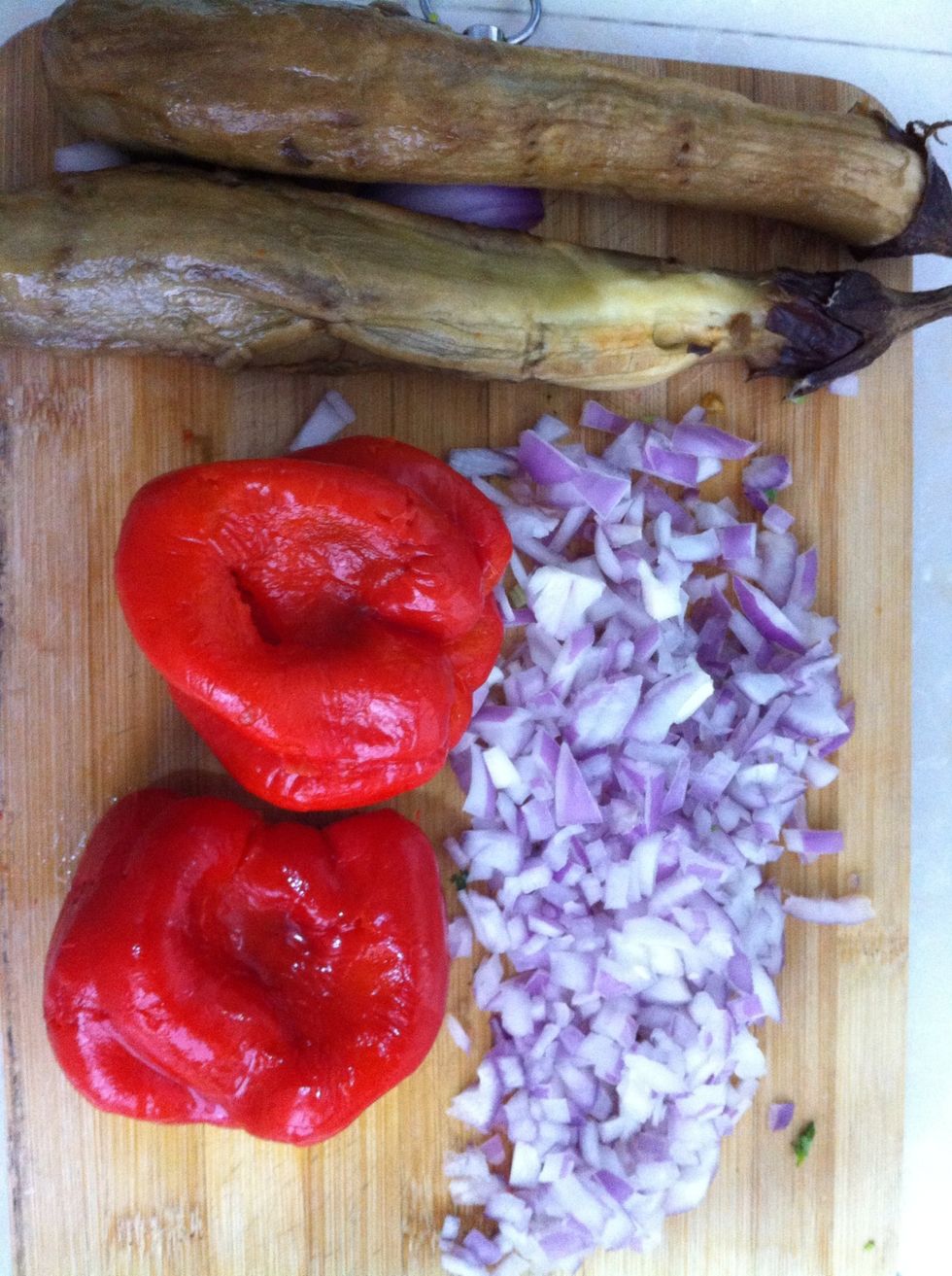 Peel the eggplants and pappers. Cut the onion. Blend them separately in blender and add to tomatoes. Add the onion. Don't forget to try while adding it. Enrich  with garlic, olive oil, salt and papper