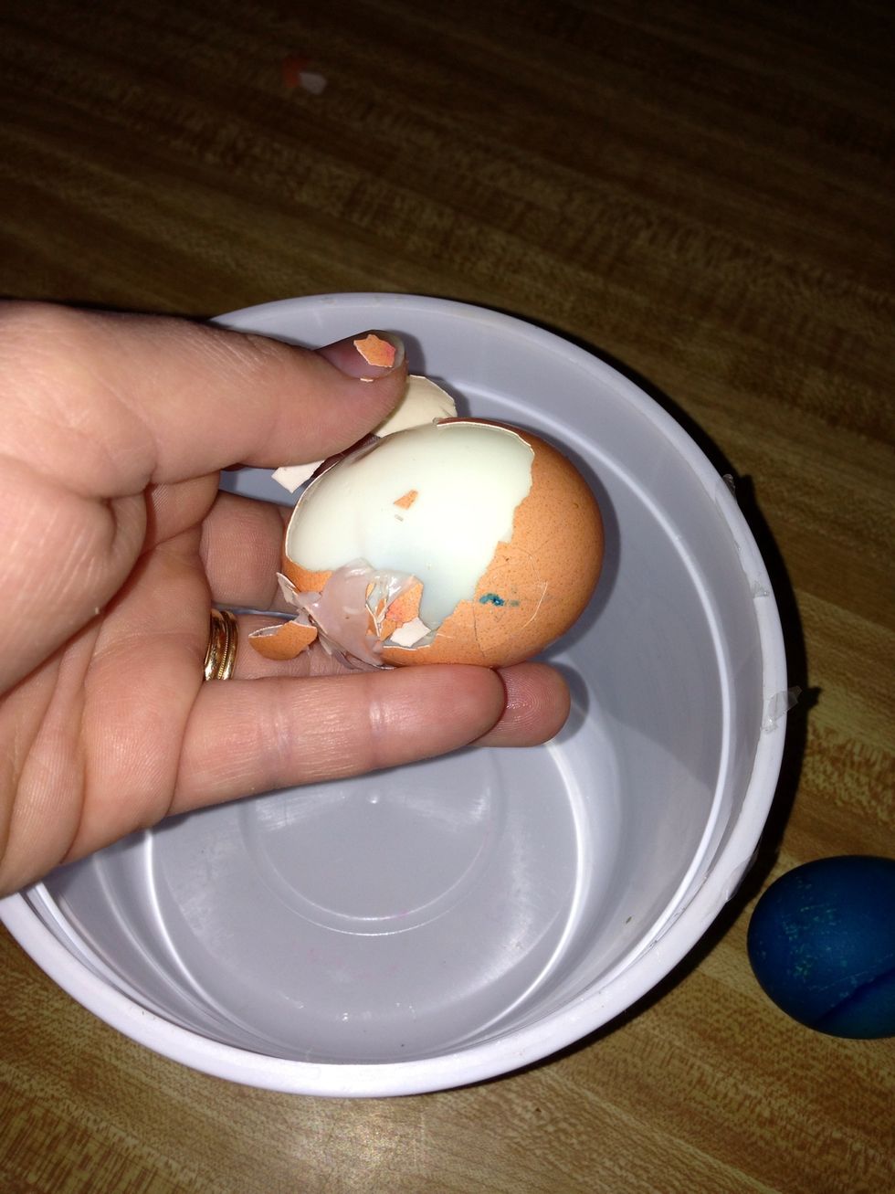 Peel the eggs. Running them under cold water while you do this makes it easier.