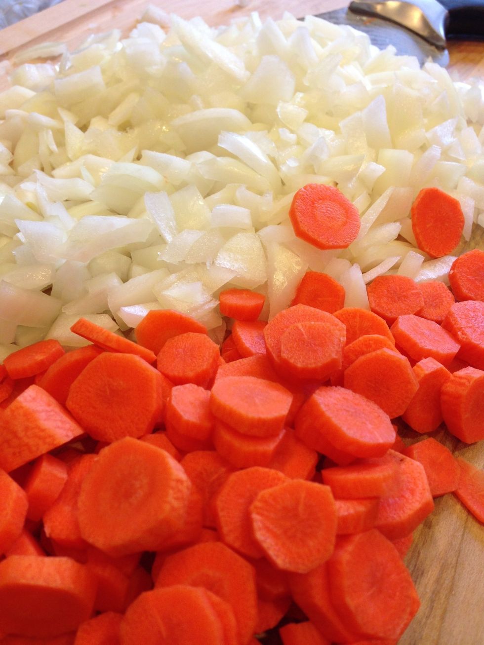 Peel the onion and the carrots. Now chop em up.