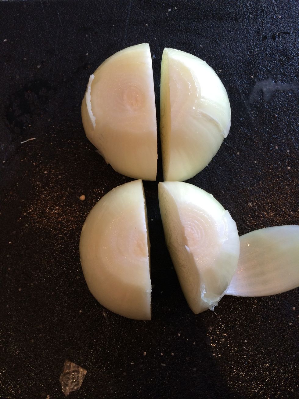 Peel the onions and cut in half lengthwise.
