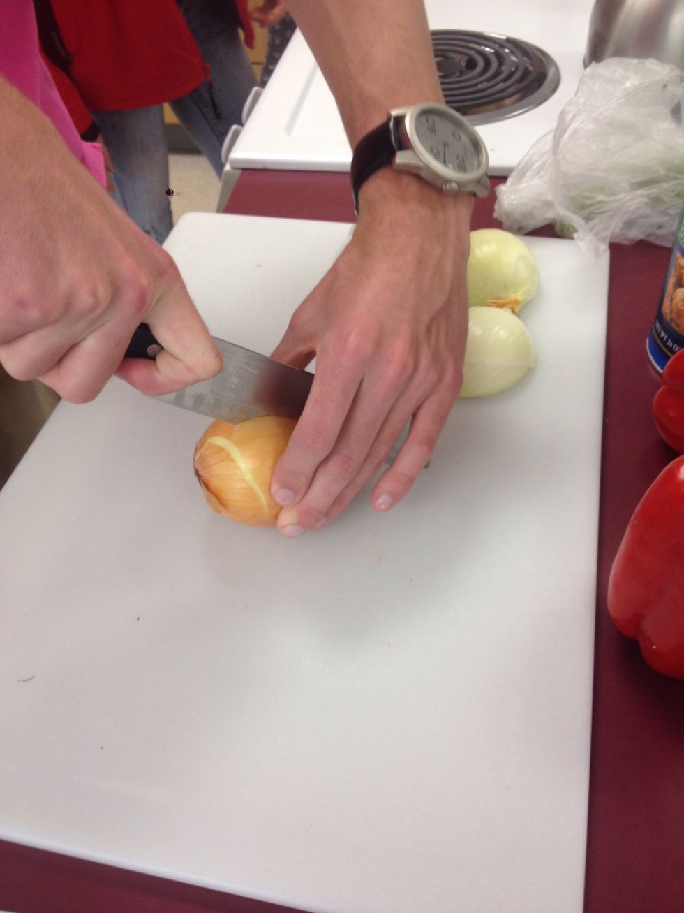 Peel the onions with the ends untrimmed, and then in half lenthwise