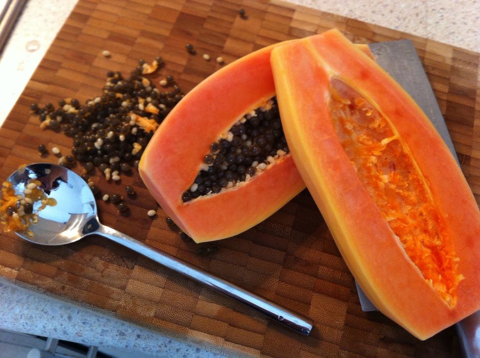 Peel the papaya, cut it in half , remove the seeds using a spoon.
