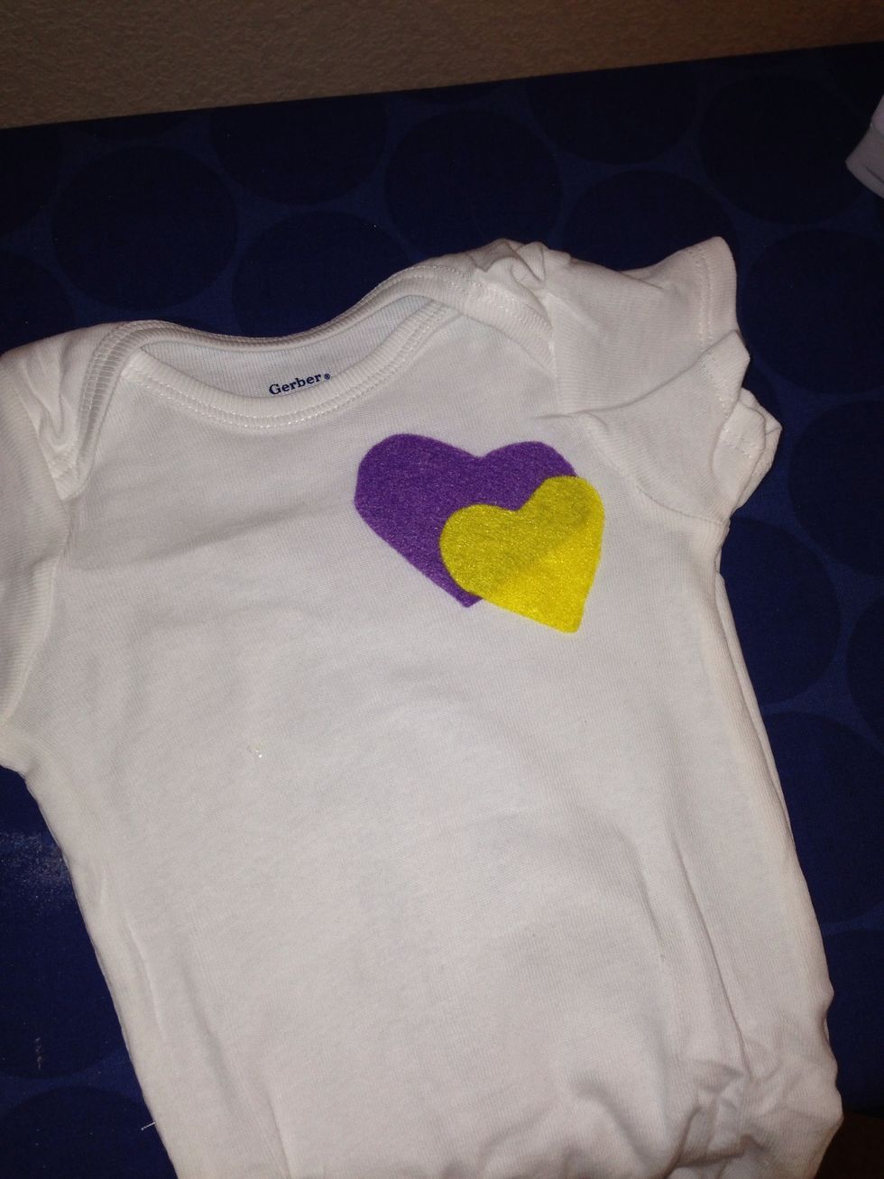 Peel the paper off the felt piece and place fusing side down on the clothing.