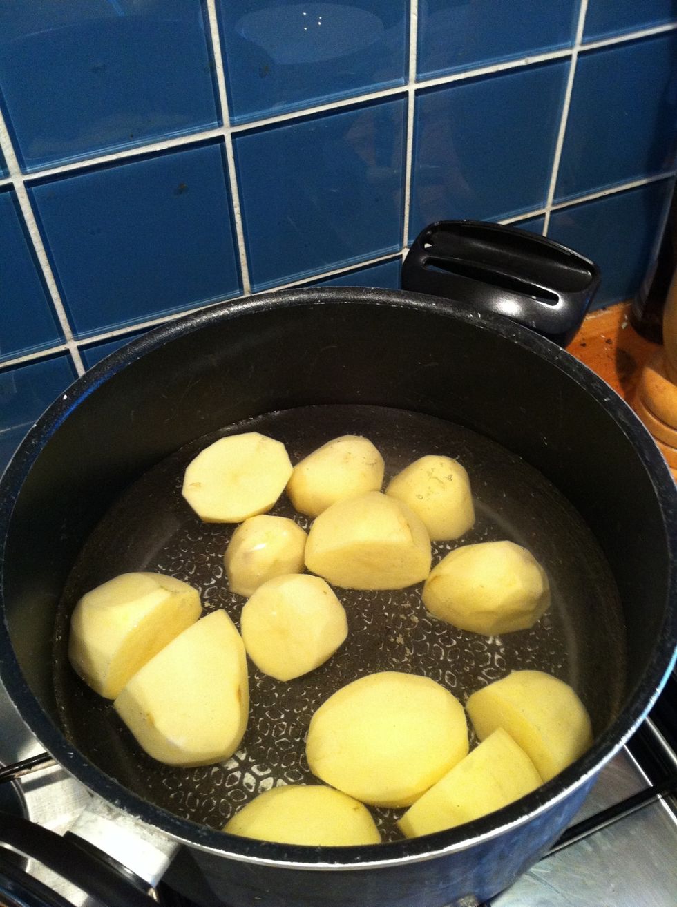 Peel the potatoes & boil until cooked.