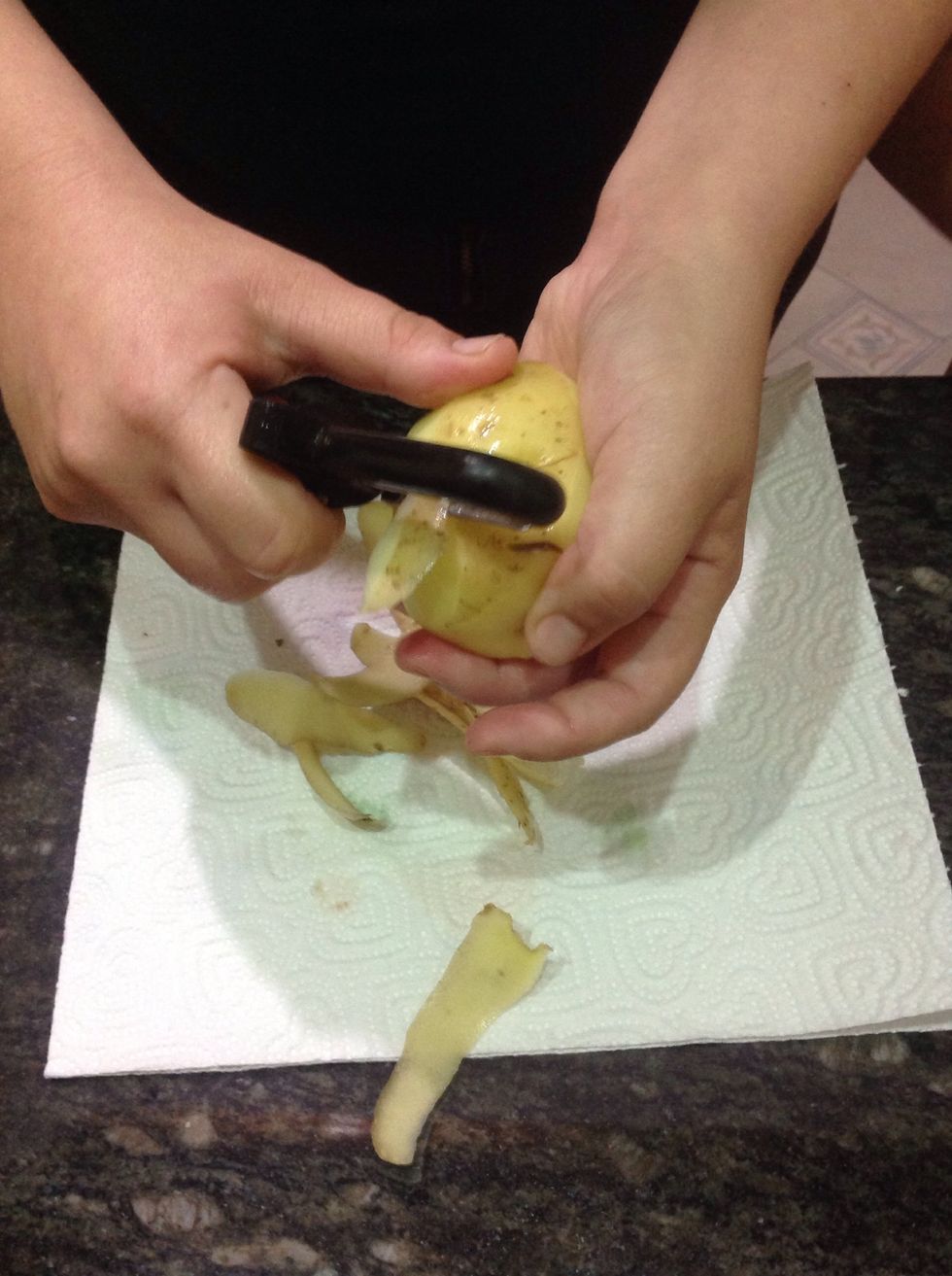 Peel the potatoes.
