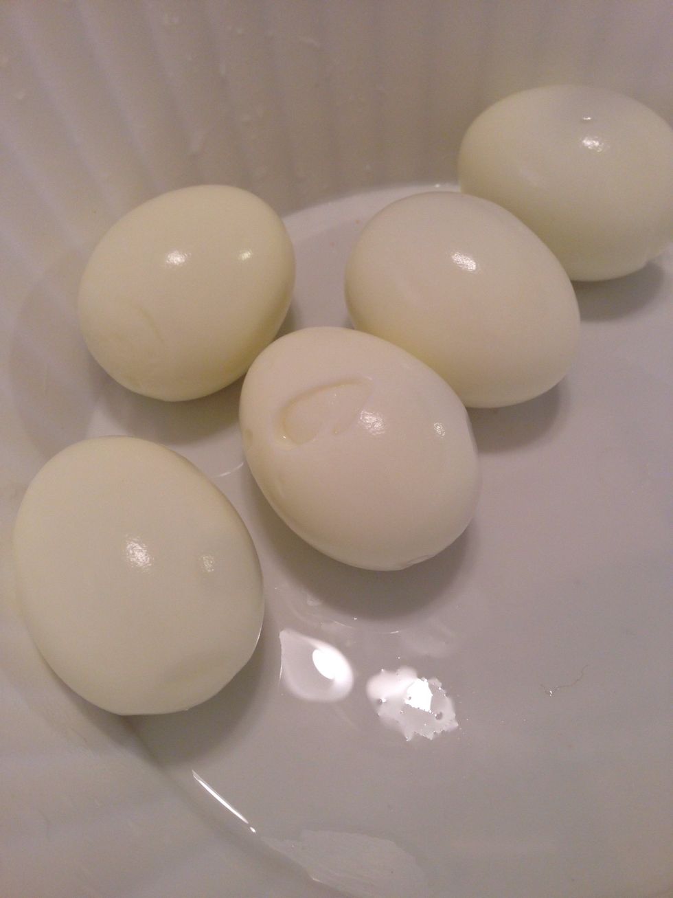 Peel the shells off the eggs, once that's done again run cold water over the eggs to cool them down some more.