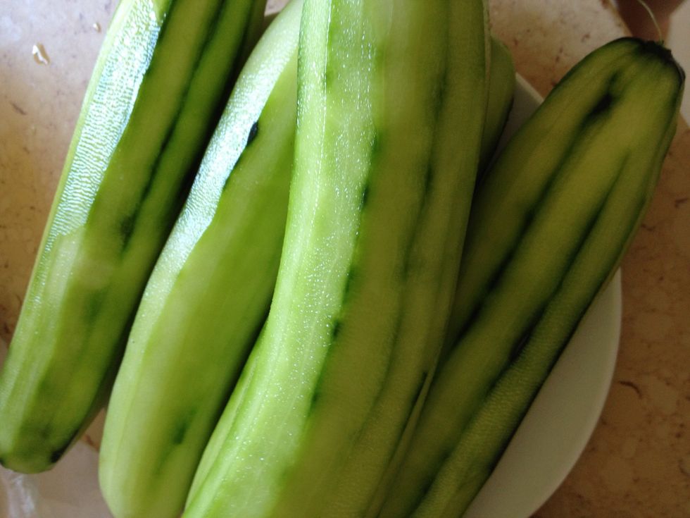 Peel the skin from the cucumbers