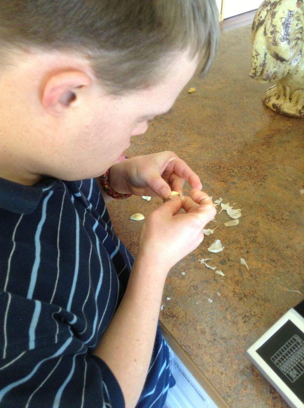 Peel the top layer off garlic cloves