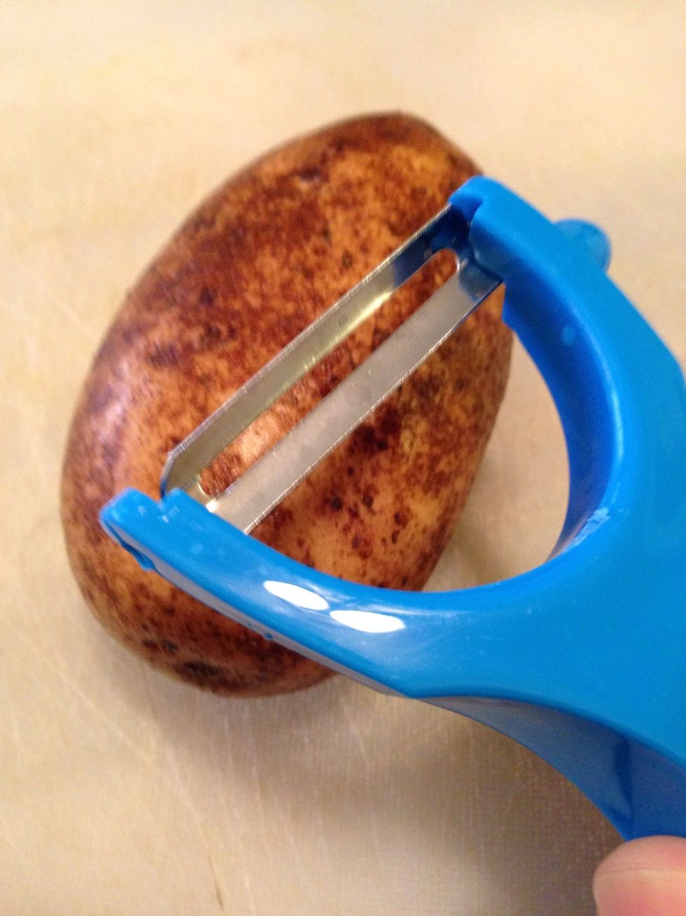 Peel the whole potato, after you peel the potatoes place them in a bowl.
