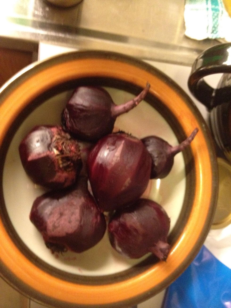 Peel them, be careful not to remove too much of the beet.