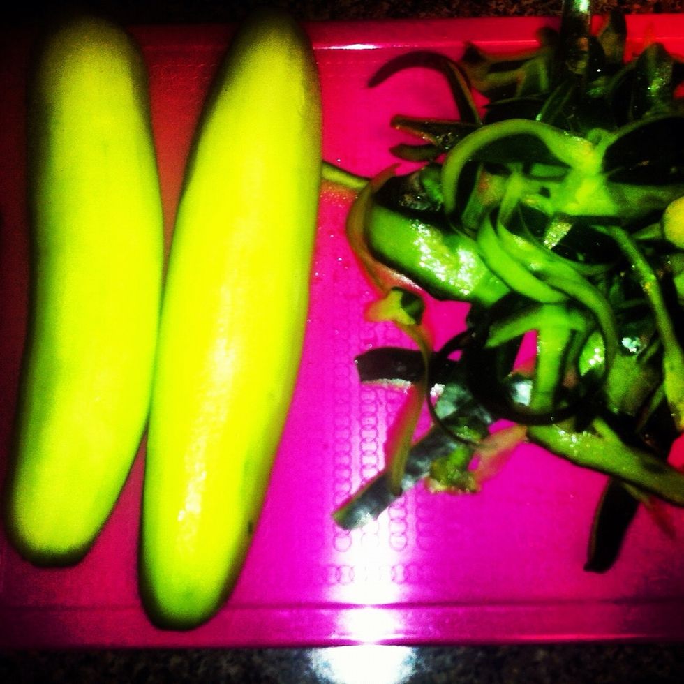 Peel two cucumbers