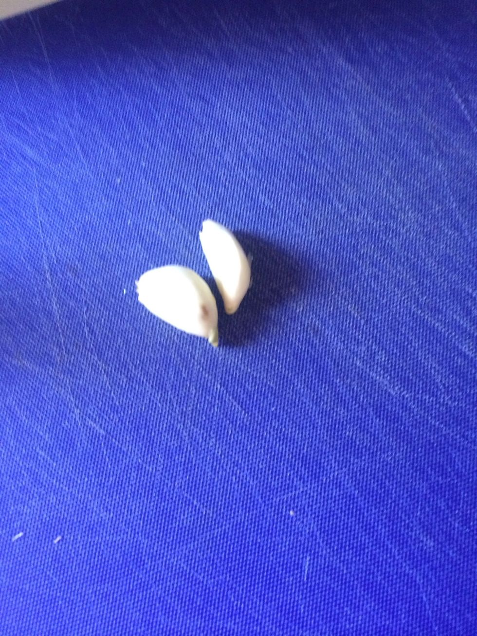 Peel two garlic cloves